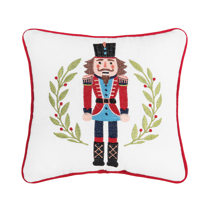 A 10in. x 10in. Nutcracker Wreath Mini Pillow.
