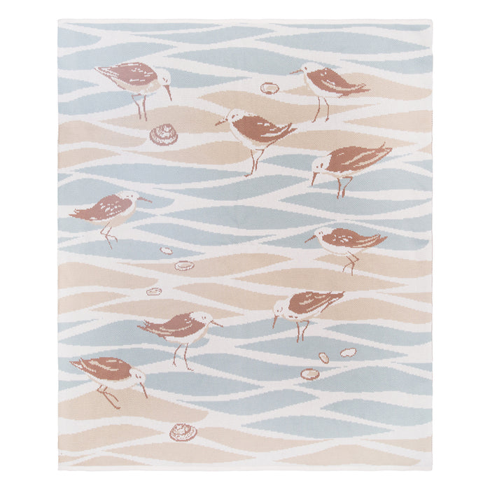 A Beach Tides Sandpiper Knit Indoor Outdoor Throw.