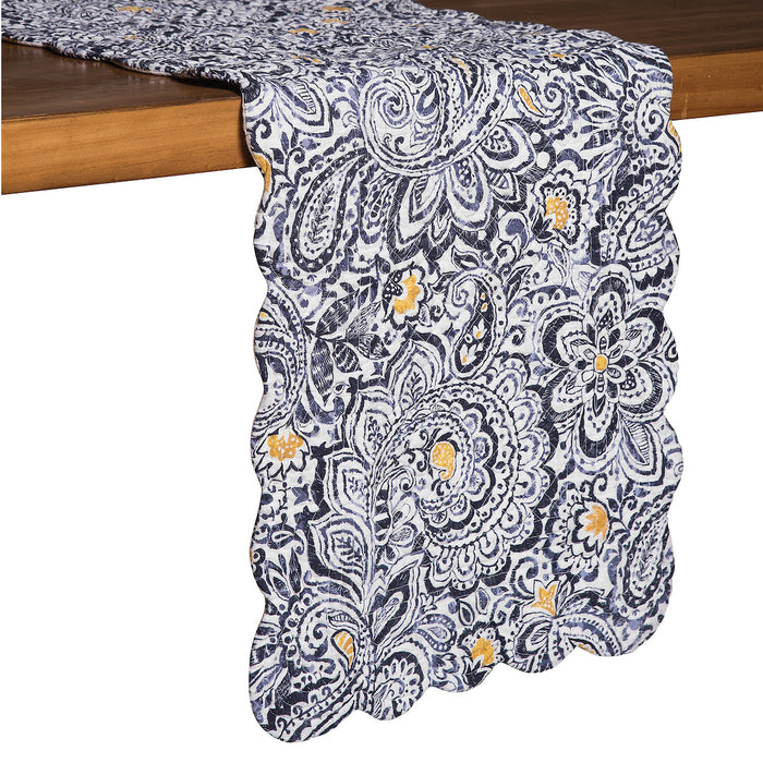 A Serena Quilted Runner displayed on a made bed.