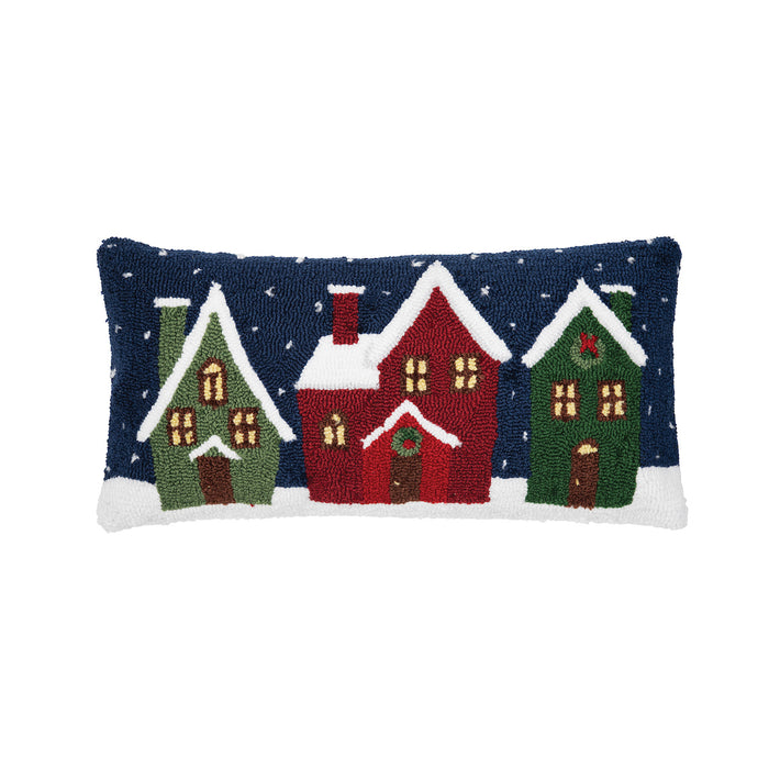 A 12in. x 24in. Winter Village Pillow.