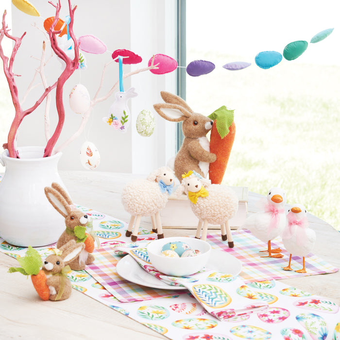 A 5.5 in. Felt Bunny Figurine.
