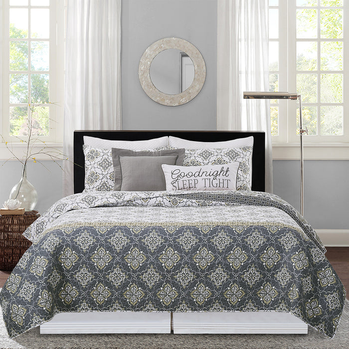 A Booker Medallion Quilt Set displayed on a made bed.