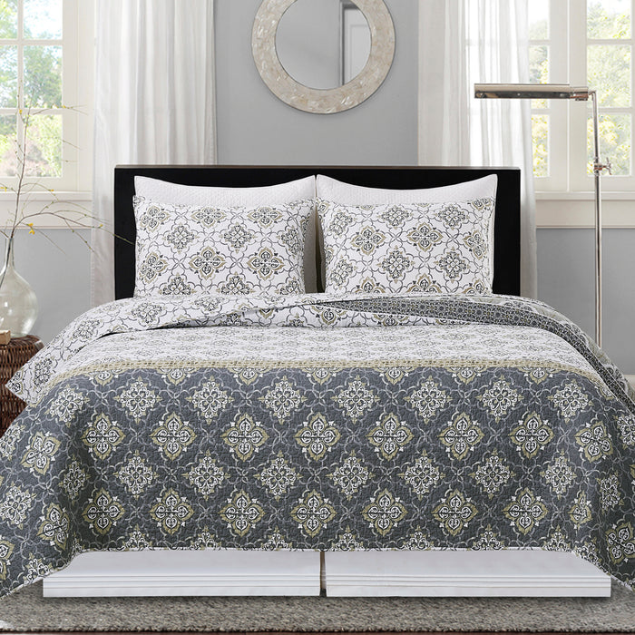 A Booker Medallion Quilt Set displayed on a made bed.
