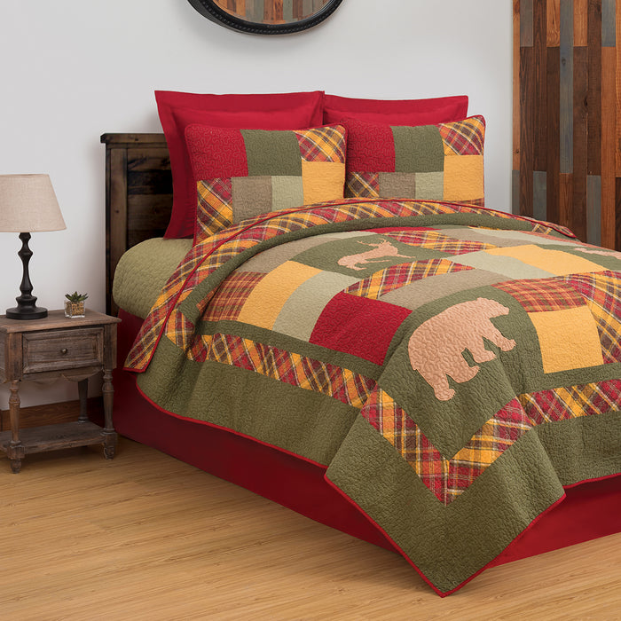 A Buckley Quilt Set displayed on a made bed.