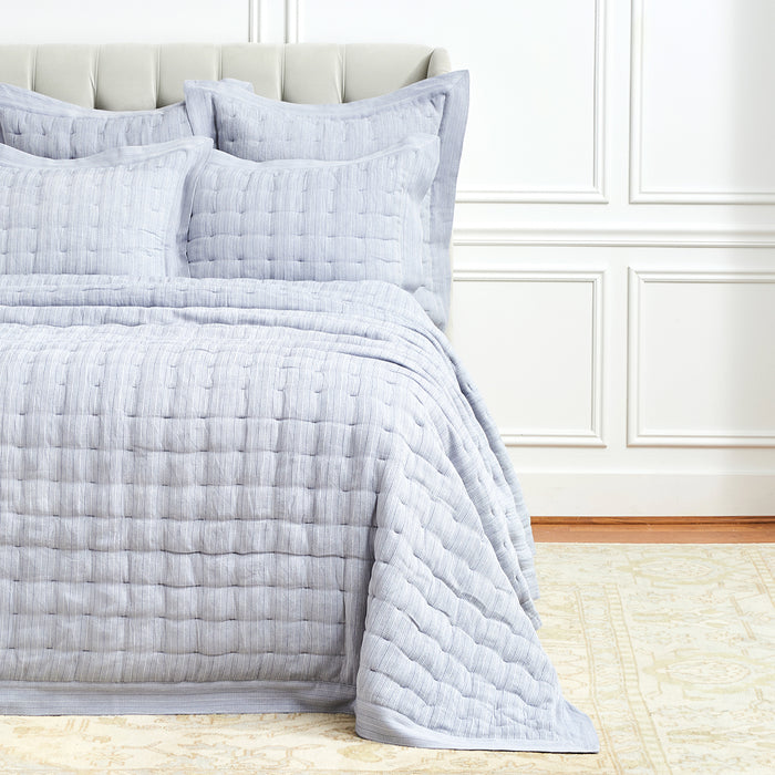 A Danette Quilt displayed on a made bed.