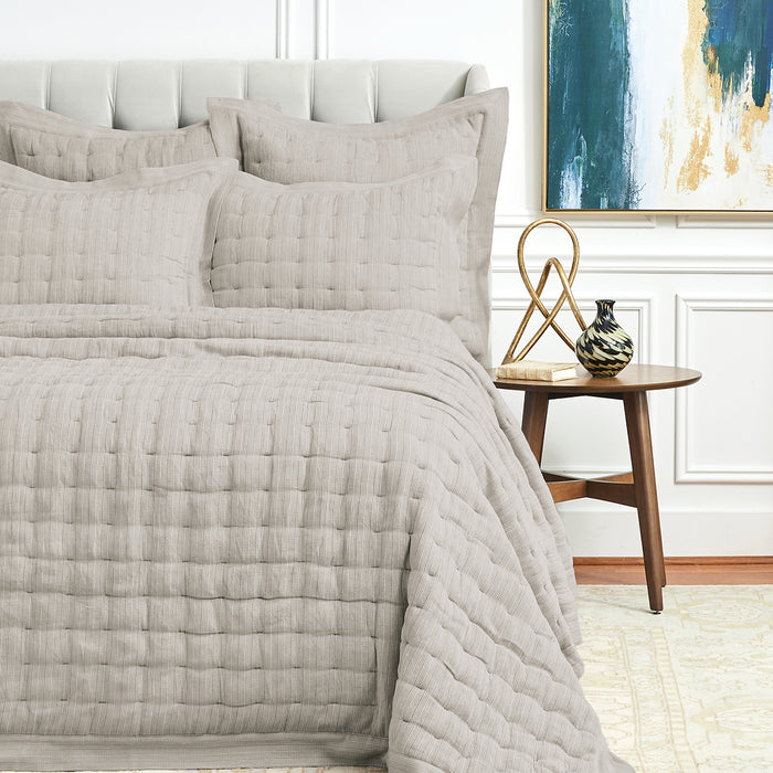 A Danette Quilt displayed on a made bed.