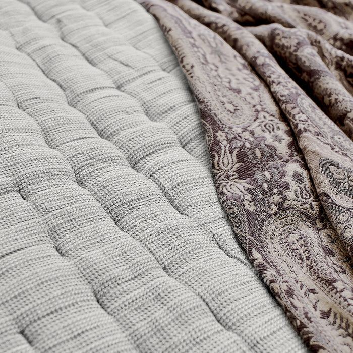 A Danette Quilt displayed on a made bed.