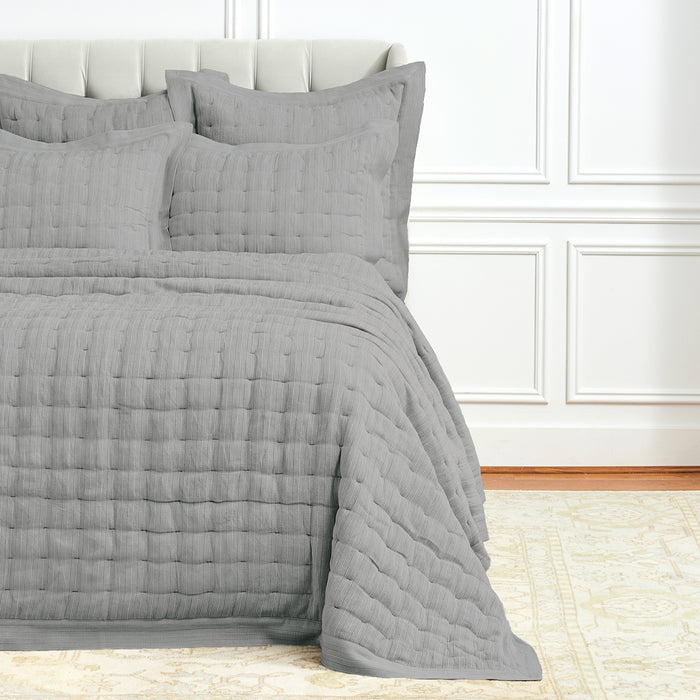 A Danette Quilt displayed on a made bed.