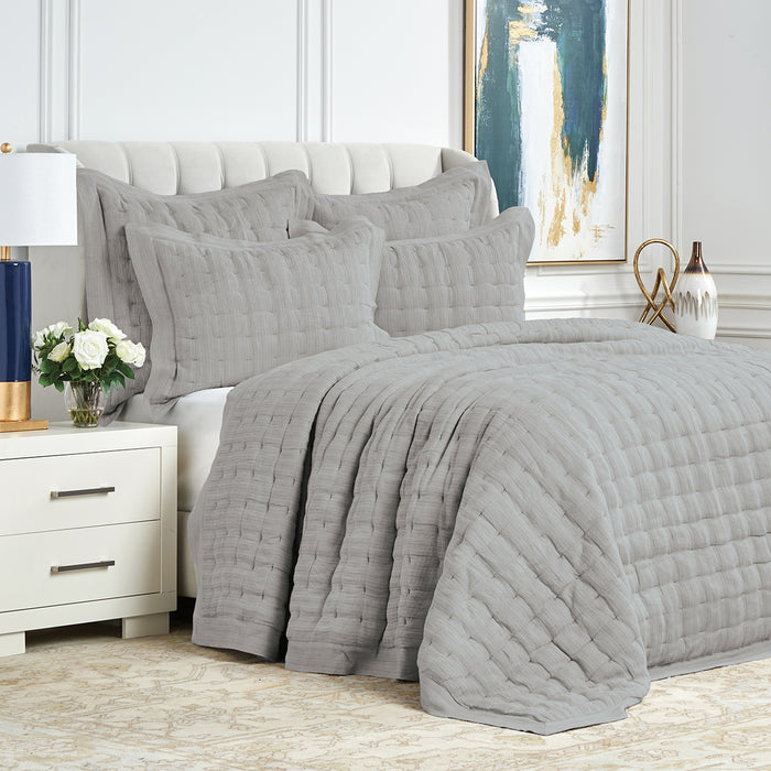 A Danette Quilt displayed on a made bed.