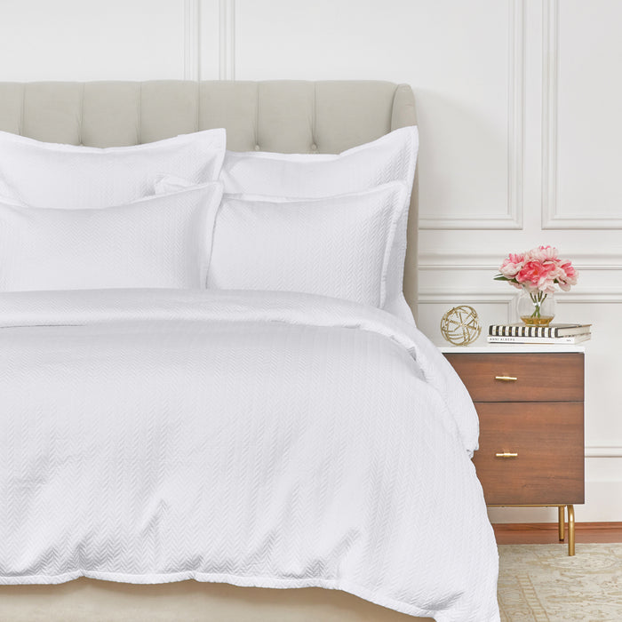 A Edin Duvet Cover displayed on a bed.