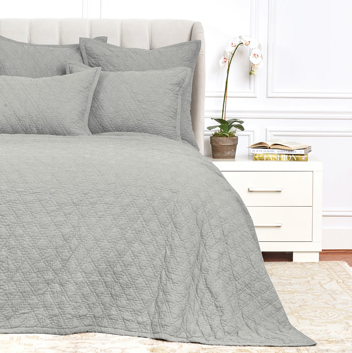 A Emory Quilt displayed on a made bed.