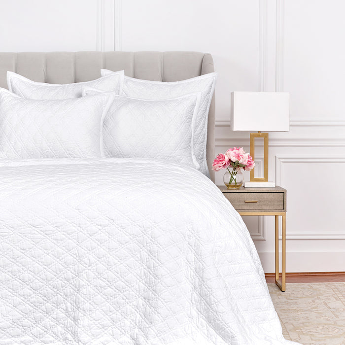 A Emory Quilt displayed on a made bed.