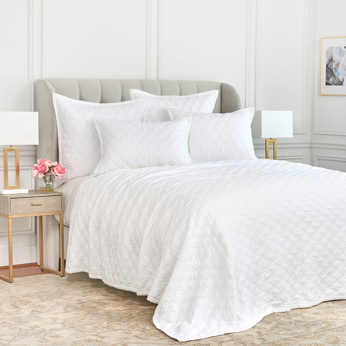 A Emory Quilt displayed on a made bed.