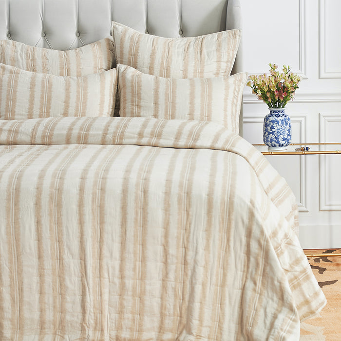 A Farren Quilt displayed on a made bed.