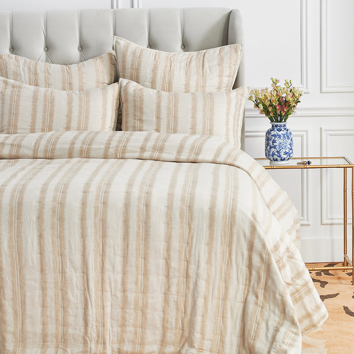 A Farren Quilt displayed on a made bed.