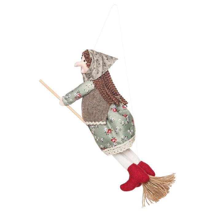 A Green Kitchen Witch Figurine.