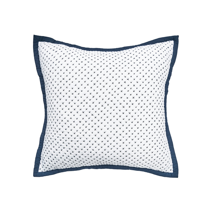 A Euro sham with a white base and Navy blue cross-stitch pattern.
