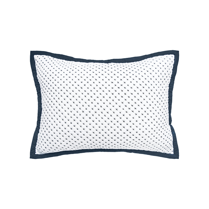 A standard-sized pillow sham with a white base and Navy blue cross-stitch pattern.