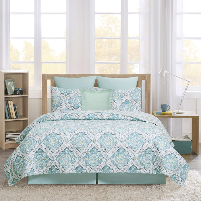 A Harlen Quilt Set displayed on a made bed.