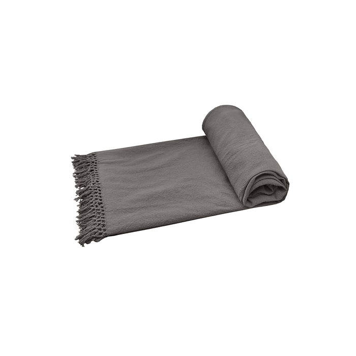 A Lavato Bed Throw displayed on a bed.