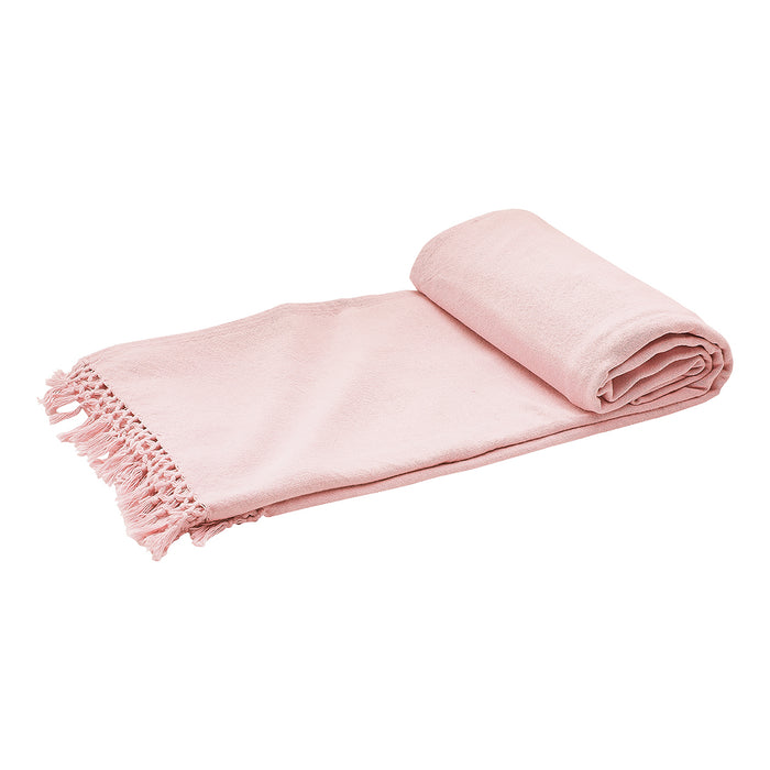 A Lavato Bed Throw displayed on a bed.