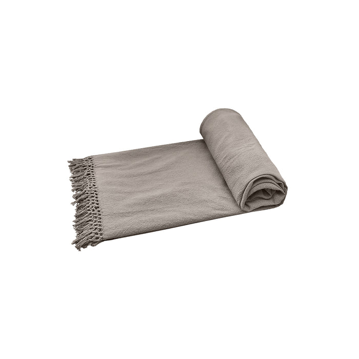 A Lavato Bed Throw displayed on a bed.