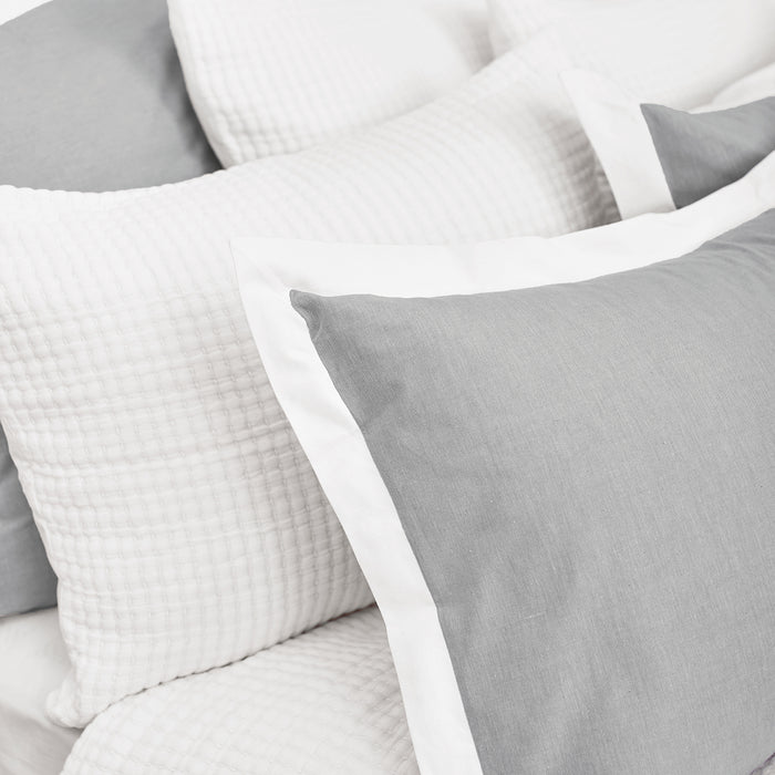 A Lida Coverlet displayed on a bed.