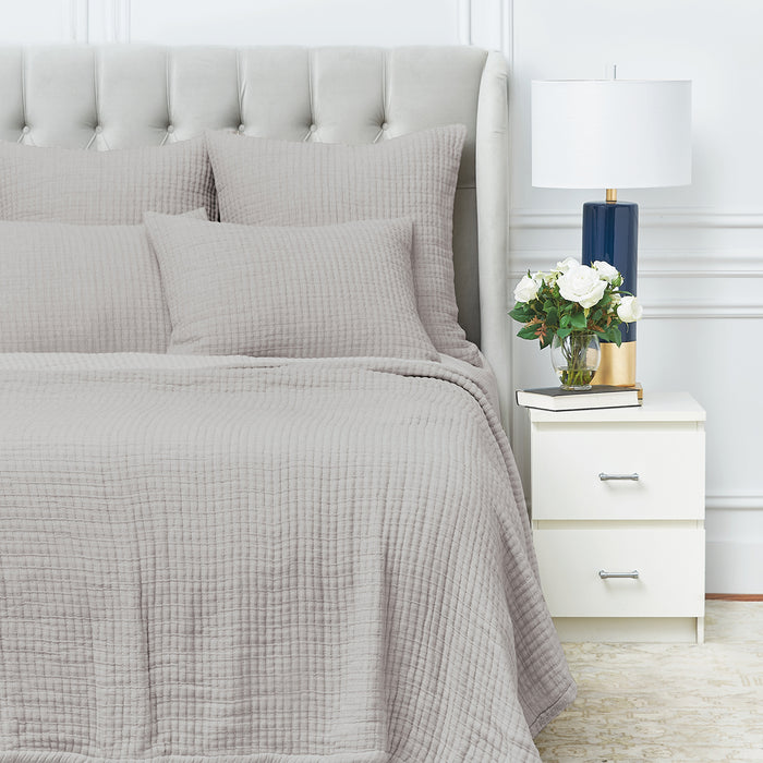 A Lida Coverlet displayed on a bed.