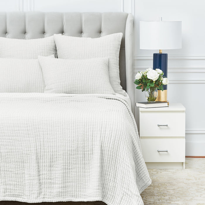 A Lida Coverlet displayed on a bed.