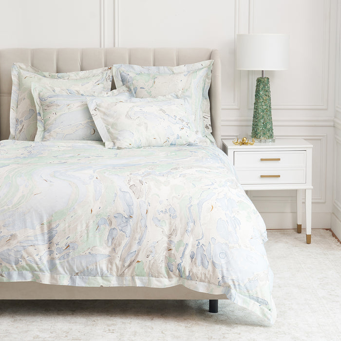 A Marble Duvet Cover displayed on a bed.