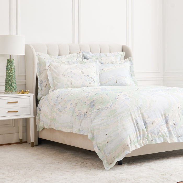 A Marble Duvet Cover displayed on a bed.