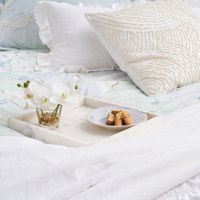 A Marble Duvet Cover displayed on a bed.