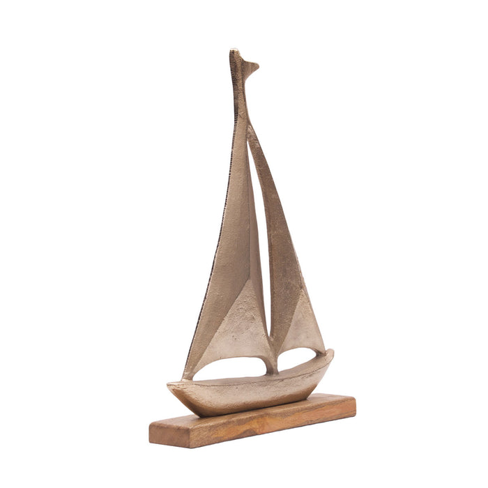 A Metal Sailboat Figure.