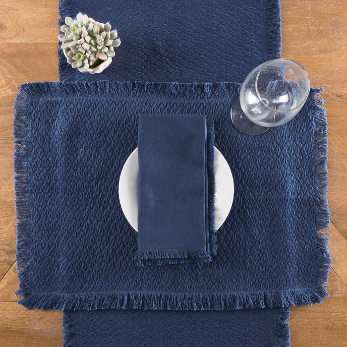 Nora Table Linens table linens displayed as a coordinated tabletop setting.