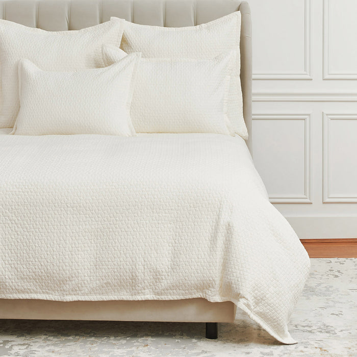 A Pernille Duvet Cover displayed on a bed.