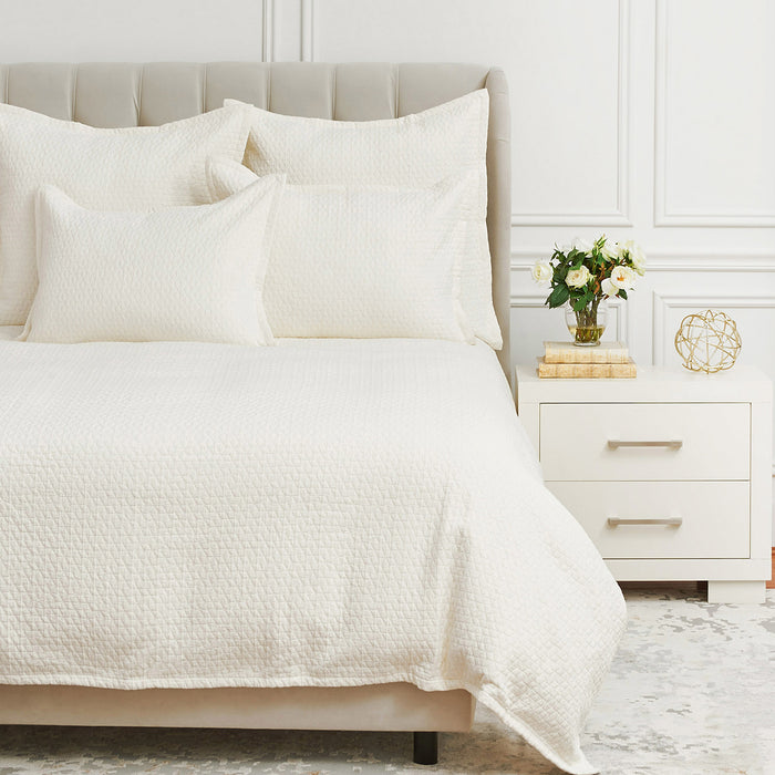 A Pernille Duvet Cover displayed on a bed.