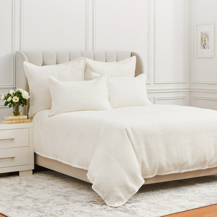 A Pernille Duvet Cover displayed on a bed.