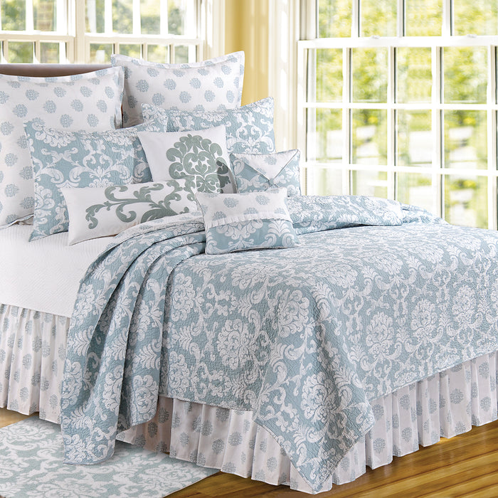 A Providence Quilt displayed on a made bed.