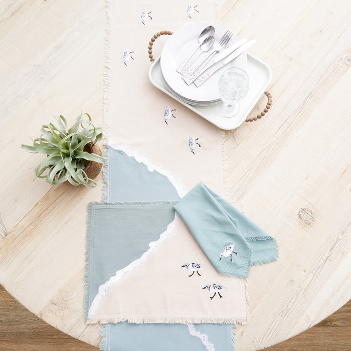 Sandpiper Sprint Table Linens table linens displayed as a coordinated tabletop setting.