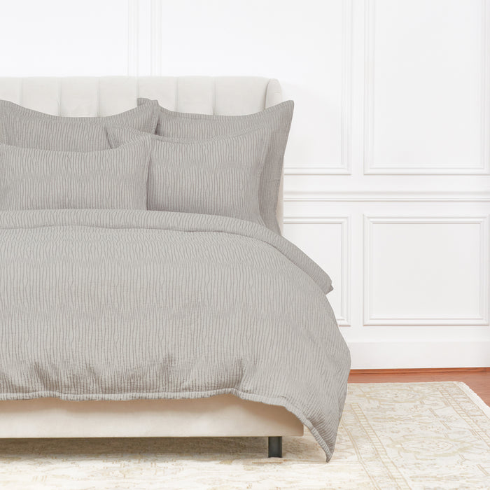 A Simone Duvet Cover displayed on a bed.