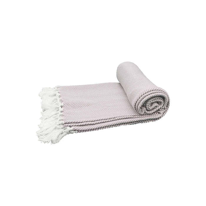 A rolled up pink grey throw blanket with a herringbone pattern and white fringes on a light background.