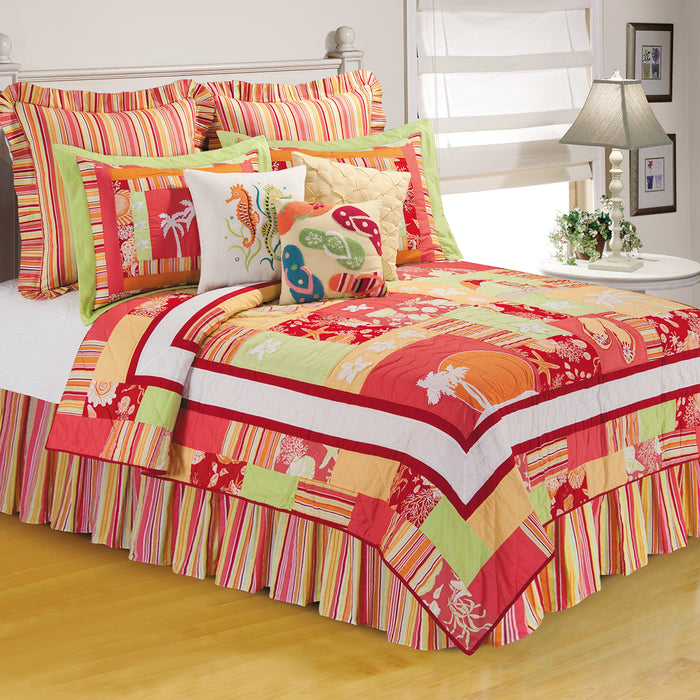 A Tropical Paradise Quilt displayed on a made bed.