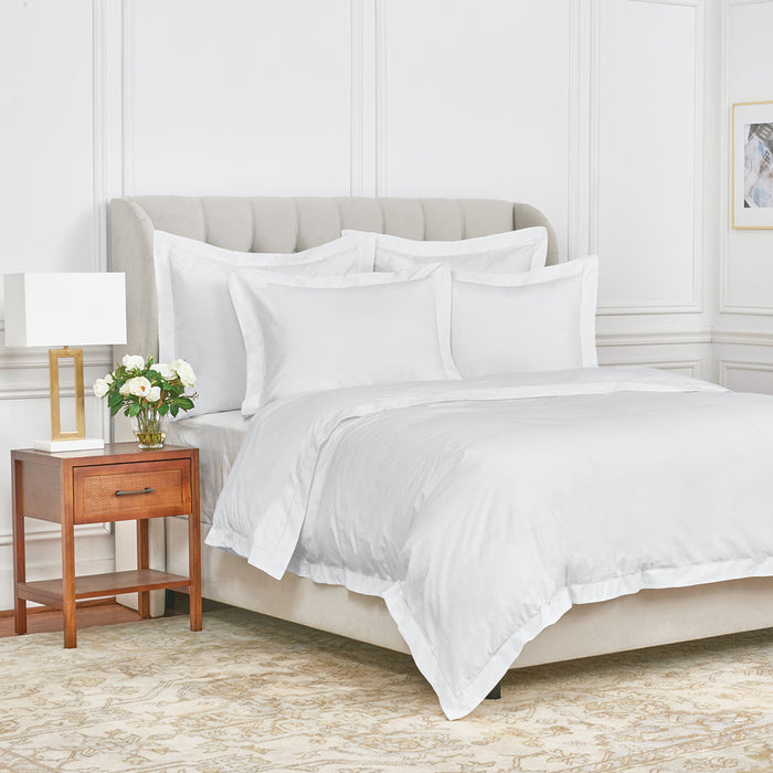 A Whitaker Duvet Cover displayed on a bed.